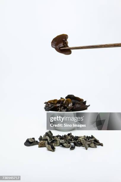 cloud ear fungus in bowl and chopsticks - auricularia auricula judae stock pictures, royalty-free photos & images