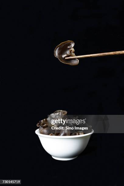 cloud ear fungus in bowl and chopsticks - auricularia auricula judae stock pictures, royalty-free photos & images