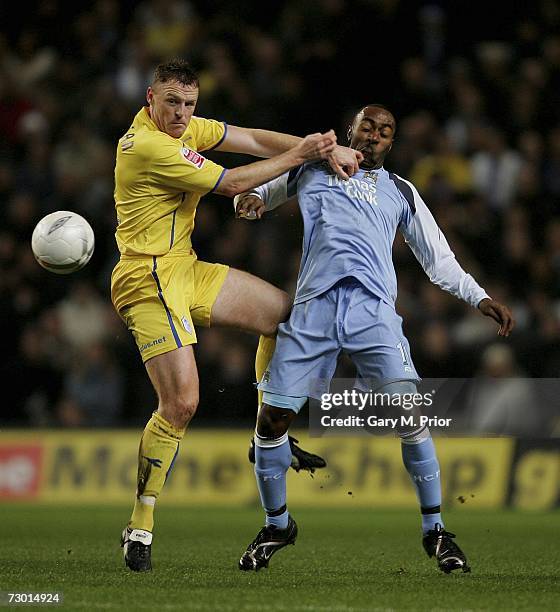 Darius Vassell of Manchester City and Graham Coughlin of Sheffield Wednesday in action during the FA Cup sponsored by E.ON Third Round Replay match...