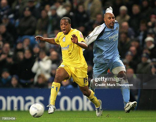 Ousmane Dabo of Manchester City tangles with Wade Small of Sheffield Wednesday during the FA Cup sponsored by E.ON Third round replay match between...