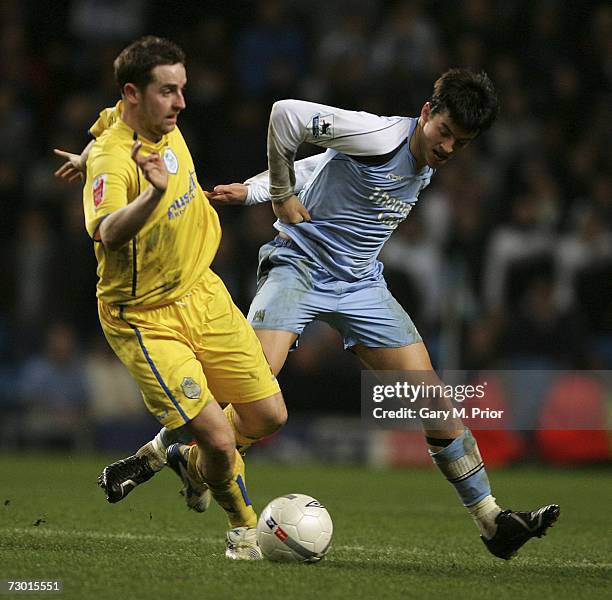 Steve MacLean of Sheffield Wednesday and Joey Barton of Manchester City in action during the FA Cup sponsored by E.ON Third Round Replay match...