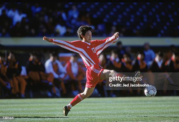 Sun Jihai of Team China stretches for the ball during the game against Team USA at the Oakland Coliseum in Oakland, California. The USA defeated...