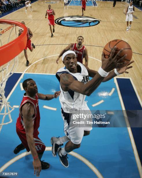 Josh Howard of the Dallas Mavericks takes the ball to the basket against the Houston Rockets at the American Airlines Center January 16, 2007 in...