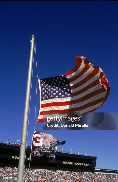 The American flag and the number 3 Flag is raised halk staff in tribute to Dale Earnhardt during the Dura Lube 400, part of the Winston Cup Series at...