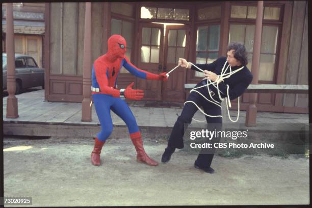 American actor Nicholas Hammond , as the costumed superhero Spider-man, wrangles a villian in an episode of the CBS television series 'The Amazing...
