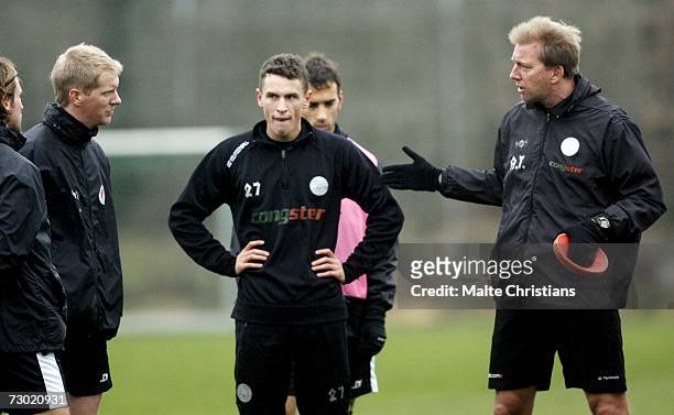 Timo Schulz and Ian Joy and coach Andre Trulsen speak during the FC St. Pauli training camp on January 17, 2007 in Schneverdingen, Germany.