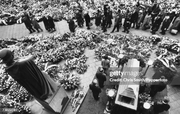 Mourners file past the coffin of Czech student Jan Palach at his funeral at Olsany Cemetery in Prague, January 1969. Palach committed suicide by...