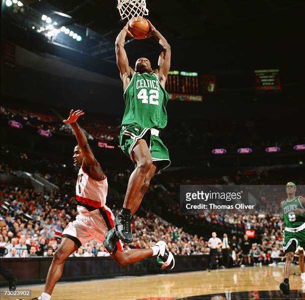 Tony Allen of the Boston Celtics elevates to the basket for a dunk against Martell Webster of the Portland Trail Blazers during a game at The Rose...
