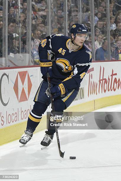 Dmitri Kalinin of the Buffalo Sabres skates with the puck against the Atlanta Thrashers on December 30, 2006 at HSBC Arena in Buffalo, New York. The...