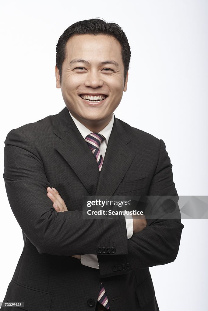 Businessman smiling, portrait