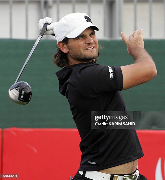 Abu Dhabi, UNITED ARAB EMIRATES: Johan Edfors of Sweden hits a tee shot during the first round of the Abu Dhabi Golf Championship in the Emirati...