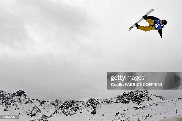 Manuel Diaz of Chile is airborn above the Swiss Alps during his men's Big Air qualification heat at the FIS Snowboard World championships in Arosa,...