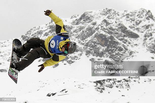 Finland's snowboarder star Antti Autti is airborne with the Swiss alps in the background during men's Big Air qualification heat at the FIS Snowboard...