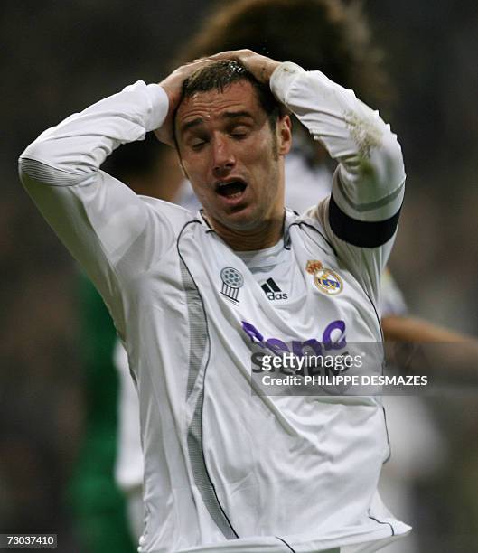 Real Madrid's captain Ivan Helguera reacts after loosing a goal during their Spanish Cup last 16 return leg match against Betis Seville at the...