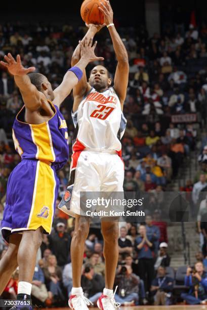 Derek Anderson of the Charlotte Bobcats shoots over Kobe Bryant of the Los Angeles Lakers during the game at Charlotte Bobcats Arena on December 29,...