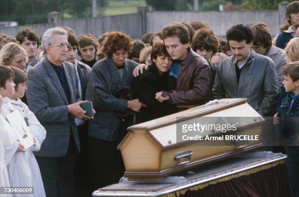The funeral of murdered four year-old boy Grégory Villemin takes place in Lepanges Sur Vologne, Vosges, France, 19th October 1984. Behind the coffin...