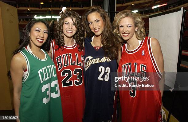 Chicago LuvaBulls dance team members Erika, Sara, Shannon and Erin model autographed jerseys prior to the start of a live auction during the 18th...