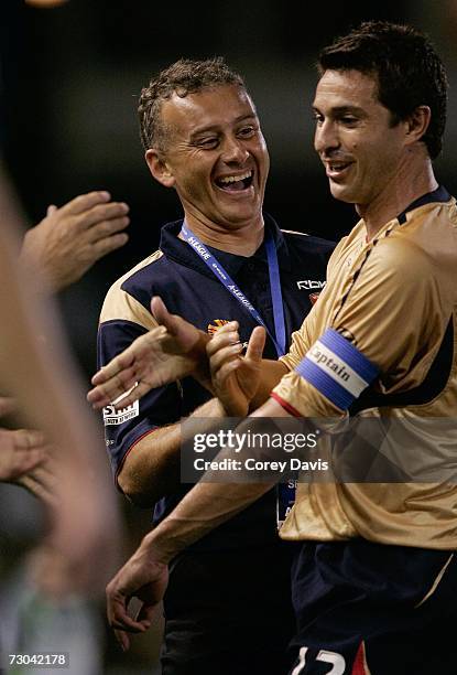 Jets coach Gary Van Egmond congratulates Paul Okon after being replaced during the round 21 Hyundai A-League match between the Newcastle Jets and the...