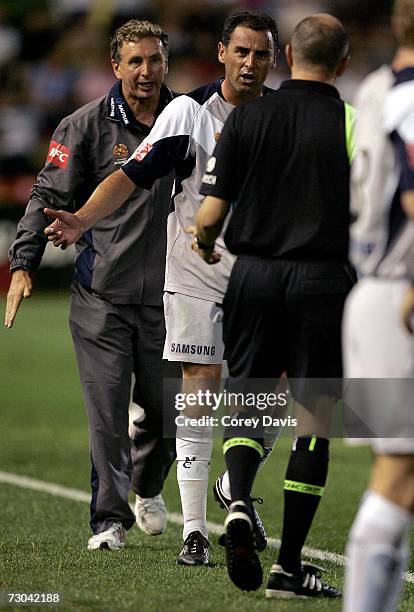 Victory coach Ernie Merrick attempts to get Kevin Muscat back into the game after he substituted himself during the round 21 Hyundai A-League match...