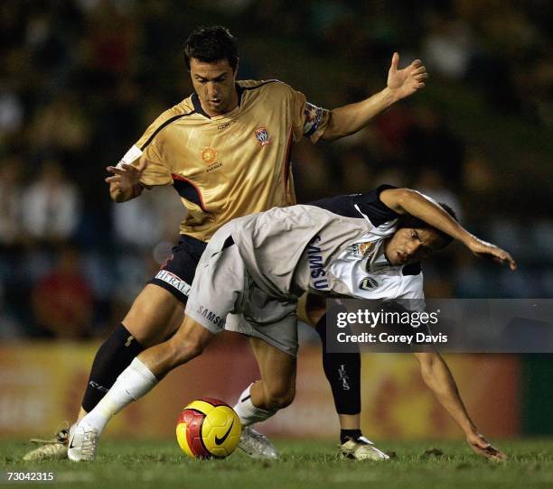 Paul Okon of the Jets challenges Fred of the Victory during the round 21 Hyundai A-League match between the Newcastle Jets and the Melbourne Victory...