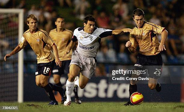 Tim Brown of the Jets and Adrian Caceres contest the ball during the round 21 Hyundai A-League match between the Newcastle Jets and the Melbourne...