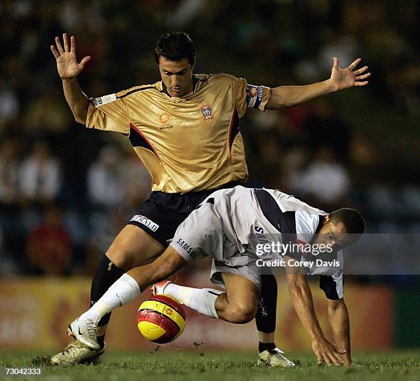 Paul Okon of the Jets challenges Fred of the Victory during the round 21 Hyundai A-League match between the Newcastle Jets and the Melbourne Victory...