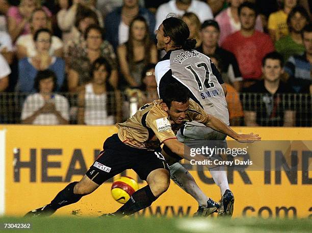 Mark Bridge of the Jets and Rodrigo Vargas of the Victory contest the ball during the round 21 Hyundai A-League match between the Newcastle Jets and...