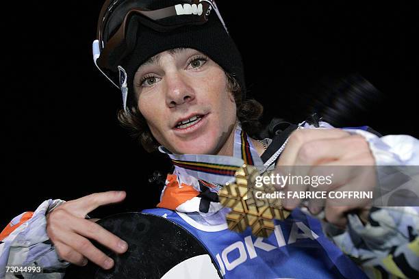 New world champion Mathieu Crepel of France shows his gold medal after he won the men's Big Air final at the FIS Snowboard World championships in...