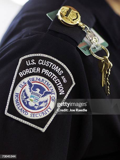 Customs and Border Protection officer works at the passport control area January 19, 2007 at Miami International Airport in Miami, Florida. Starting...