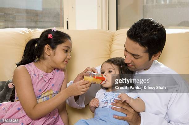 father with children in the living room - hot middle eastern girls stock pictures, royalty-free photos & images