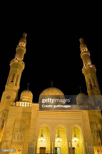 illuminated view of the mosque seen during at night - jumeirah mosque stock pictures, royalty-free photos & images