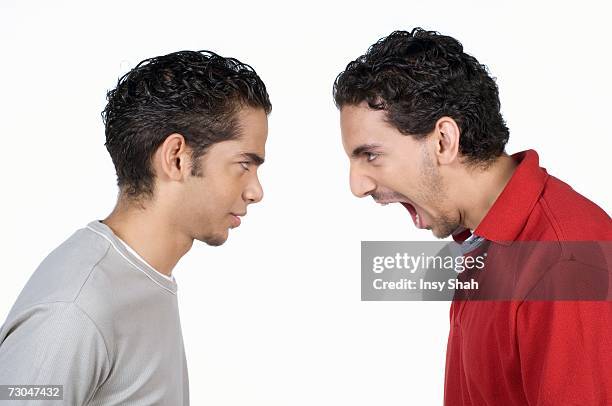 brothers angry with each other - sibling conflict stock pictures, royalty-free photos & images