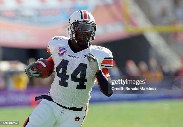 Running back Ben Tate of the Auburn Tigers carries the ball during the AT&T Cotton Bowl Classic against the Nebraska Cornhuskers on January 1, 2007...