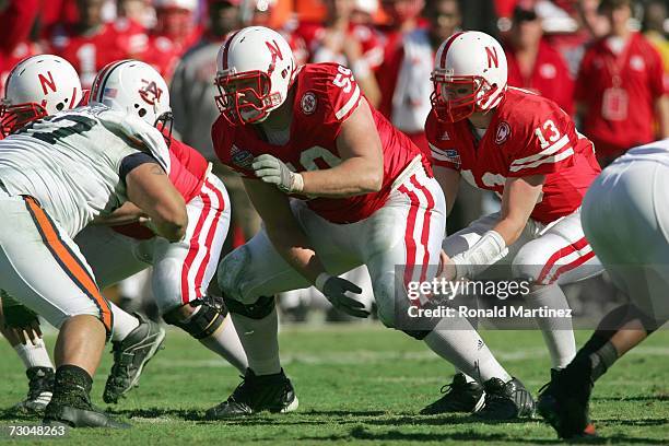 Quarterback Zac Taylor of the Nebraska Cornhuskers calls the hike from center Brett Byford during the AT&T Cotton Bowl Classic against the Auburn...