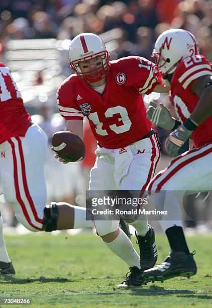 Quarterback Zac Taylor of the Nebraska Cornhuskers looks to hand off the ball during the AT&T Cotton Bowl Classic against the Auburn Tigers on...