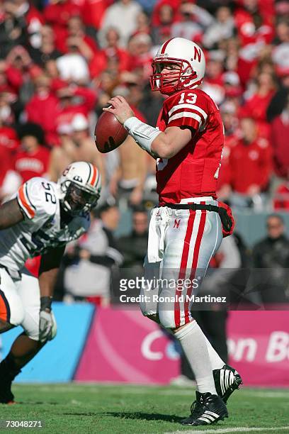 Quarterback Zac Taylor of the Nebraska Cornhuskers looks to pass the ball downfield during the AT&T Cotton Bowl Classic against the Auburn Tigers on...