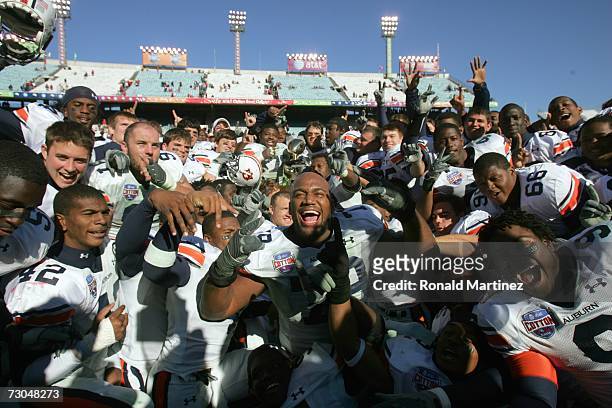 The Auburn Tigers celebrate after a 17-14 win against the Nebraska Cornhuskers during the AT&T Cotton Bowl Classic on January 1, 2007 at the Cotton...
