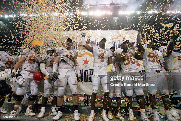 Kasey Studdard, Rashad Bobino, Brian Robison, Limas Sweed, Tim Crowder, and Brian Orakpo of the Texas Longhorns celebrate a 26-24 win against Iowa...