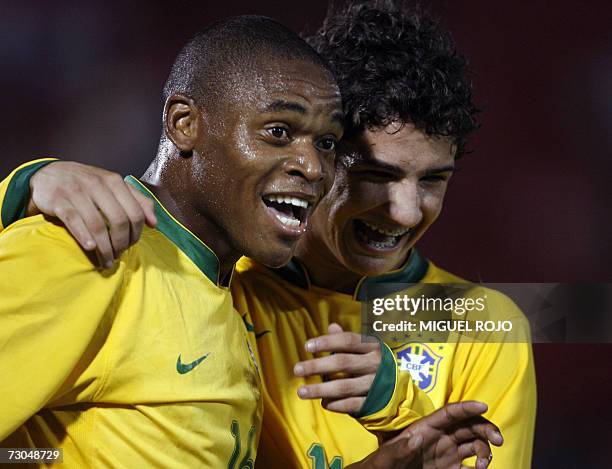Brazil's Luiz Adriano Souza Da Silva celebrates with teammate Alexandre Pato Rodrigues after opening the score against Argentina during their South...