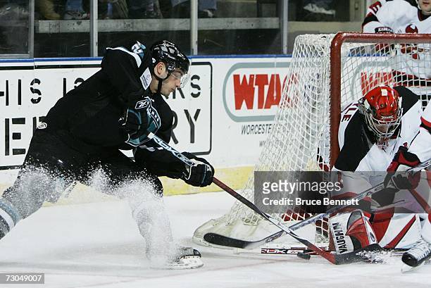 Goaltender Frank Doyle of the Lowell Devils makes the stop on Josh Prudden of the Worcester Sharks in American Hockey League action on January 19,...