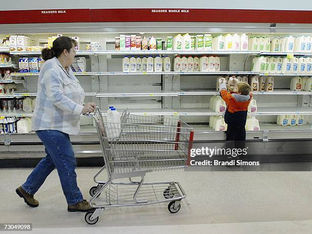 Rosemary Johnson and her grandson Joshua Johnson 6, shop for milk which is in short supply at Reasor's grocery store on January 19, 2007 in Owasso,...