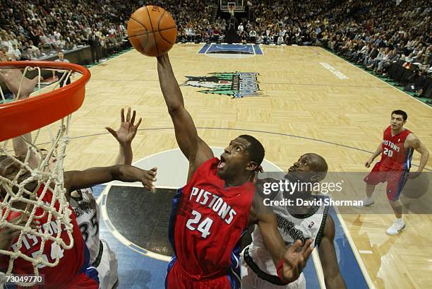 Kevin Garnett of the Minnesota Timberwolves guards against Antonio McDyess of the Detroit Pistons on January 19, 2007 at the Target Center in...