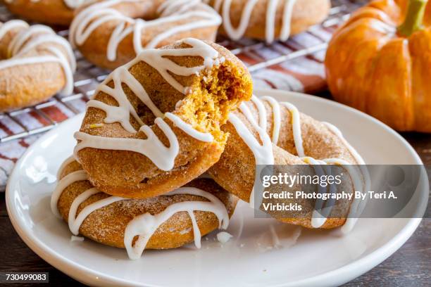 doughnuts - pumpkin donuts stock pictures, royalty-free photos & images