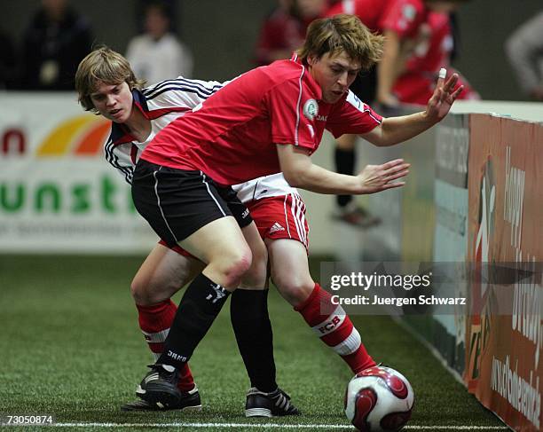 Crailsheim's Daniela Held and Munich's Katharina Baunach fight for the ball during the Women's German Indoor Cup match between Bayern Munich and TSV...