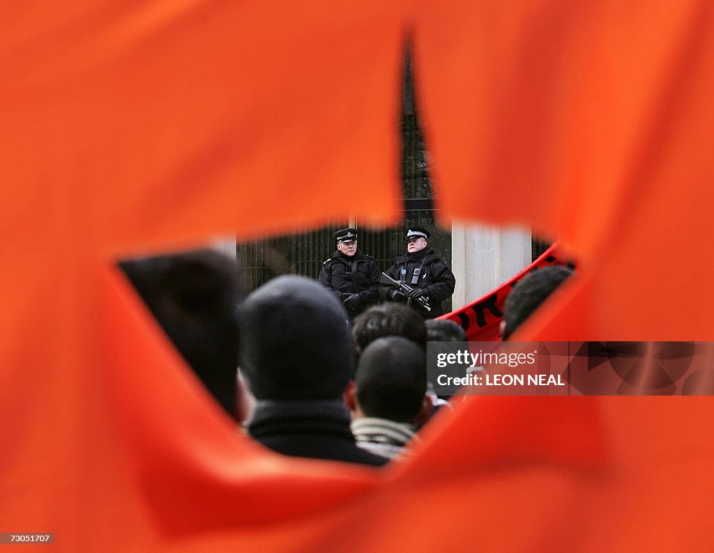 Armed police watch supporters of the HIz