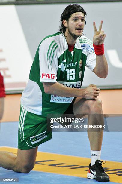 Hungarian player of Spanish Barcelona, Laszlo Nagy kneels on field and shows shows number two with hiw fingers during their preliminary Group E match...