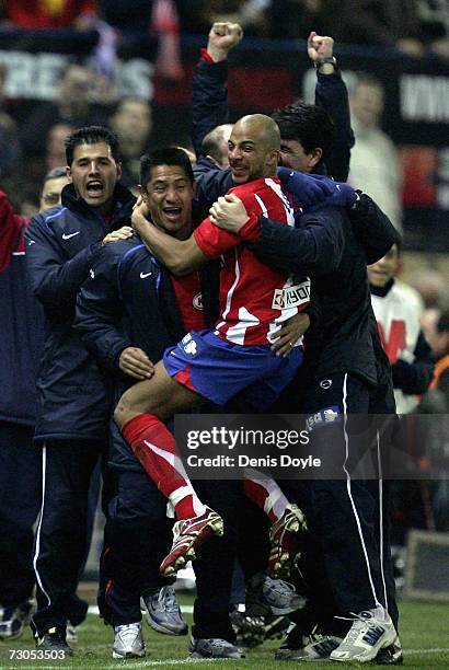 Peter Luccin of Atletico Madrid celebrates after his side scored a goal against Osasuna during the La Liga match between Atletico Madrid and Osasuna...