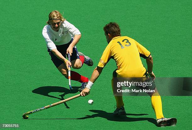 Ashley Jackson of Great Britain takes on the defence in the gold medal match between Australia and Great Britain during the Hockey competition of the...