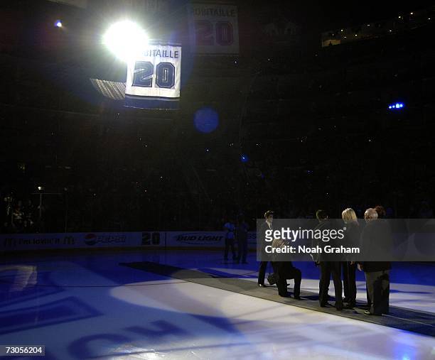 Luc Robitaille watches with his family as his jersey is retired before the Los Angeles Kings play against the Phoenix Coyotes on January 20, 2007 at...