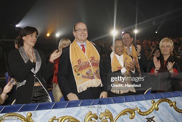 In this handout image released by Monaco Palace, Princess Stephanie of Monaco, Prince Albert of Monaco and French singer Henri Salvador attend the...